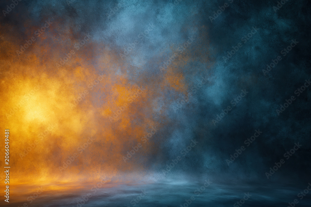 Obraz premium Abstract studio backdrop with dark blue mist and warm golden light, textured smoke background