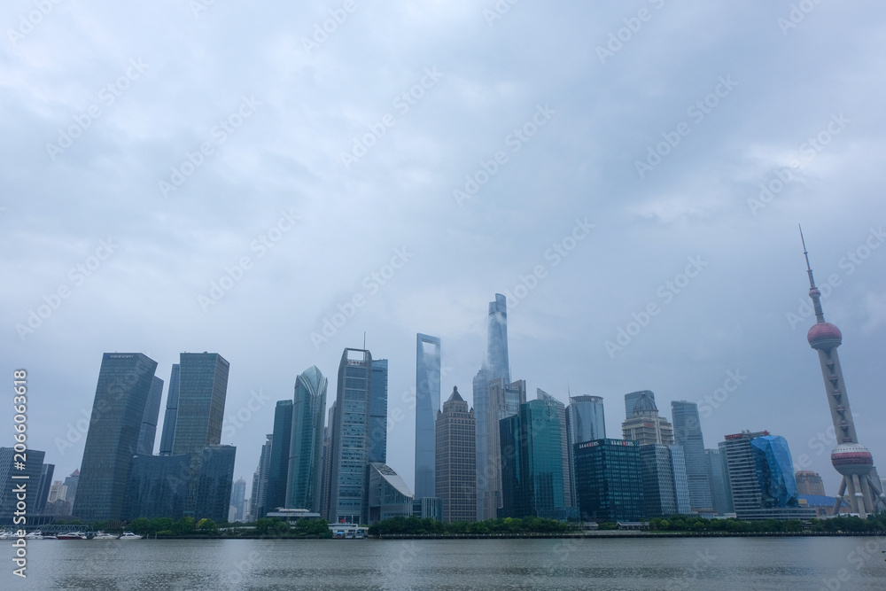 Fototapeta premium The Pedestrian Walkway along the Huangpu River with the Oriental Pearl Tower in North Bund, Shanghai, Taken in 2018