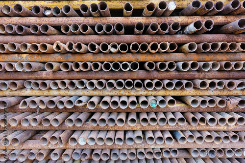 Photography Close-up of Neatly Stacked Scaffolding Steel Pipes at a Construction Site in Sha