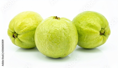 Fresh green guavas on white background.