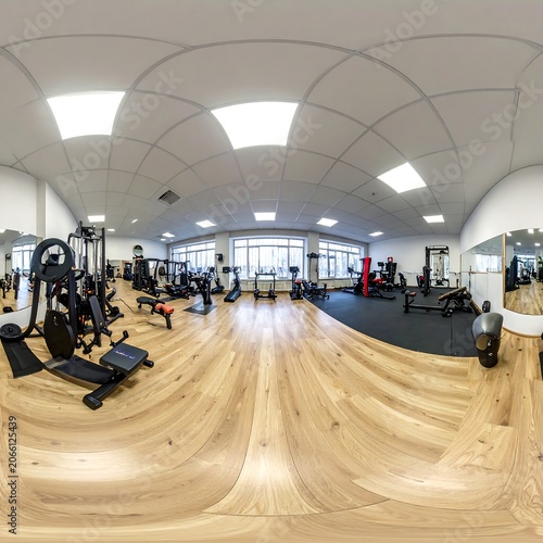 A 360-degree view of a modern, well-equipped gym interior with wooden flooring