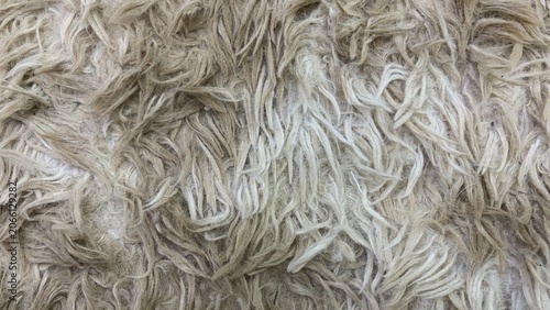 Fotografía Close-up of shaggy fabric surface with long intertwined fibers forming a soft, t