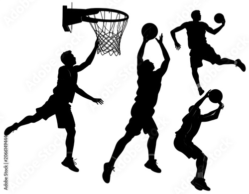 A black and white image of four basketball players in various poses