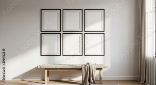 Modern minimalist wall art display with empty frames and wooden bench