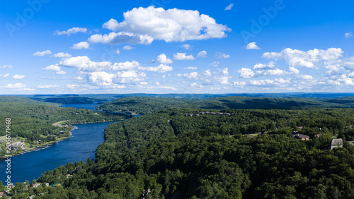     Aerial view of Deep Creek Lake surrounded by forest in western Maryland