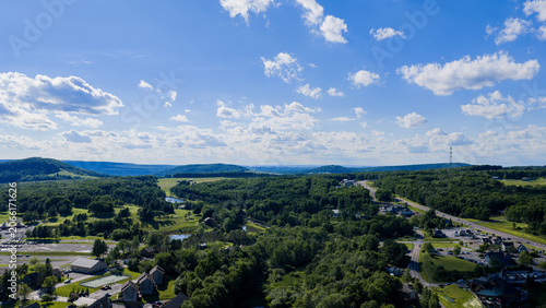  Aerial view of Deep Creek Lake surrounded by forest in western Maryland
