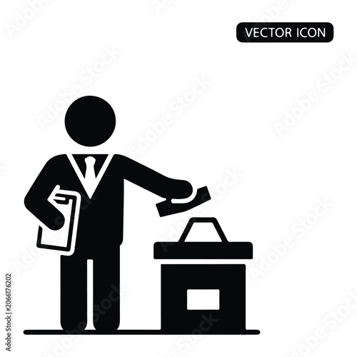 Man in suit casting a ballot into a box, holding papers
