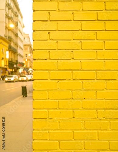 Yellow brick wall in city