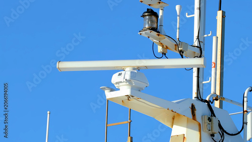 Canvas Print Close-up of a White Ship Radar and Mast Against Blue Sky