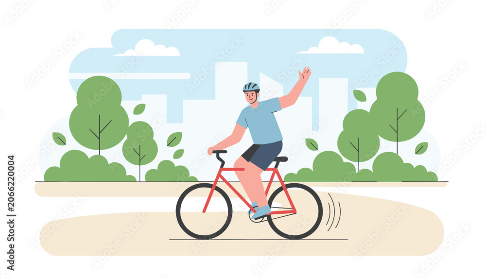 Fototapeta premium Happy man wearing a safety helmet waves as he rides his red bicycle along a park pathway on a clear sunny day.