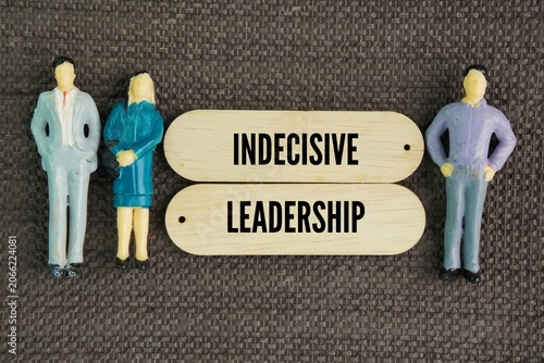 Tableau sur toile Miniature and wooden people with the words Indecisive Leadership