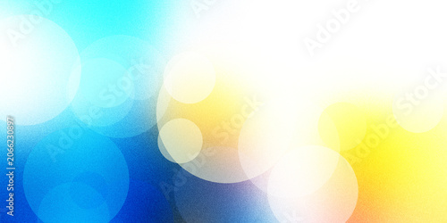 Schilderij op canvas Abstract background featuring glowing circular bokeh light patterns on vibrant blue and yellow gradient surface with grainy texture