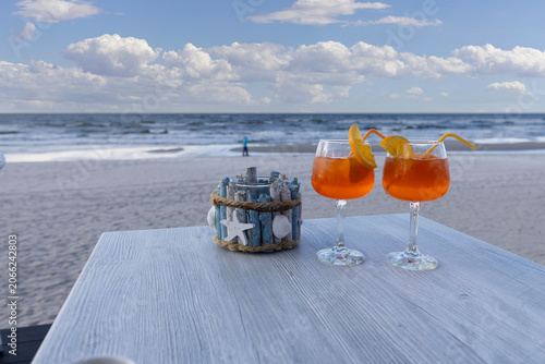 Beach cafe, two aperol drinks on the table, Baltic Sea, Poland