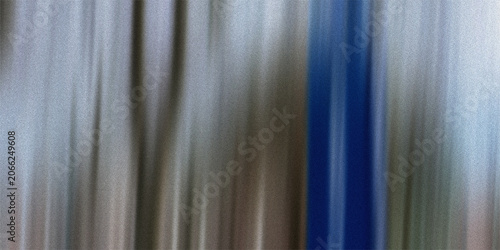 Bild auf Leinwand Abstract background featuring vertical flowing streaks with metallic grey silver and blue color tones creating smooth silk effect