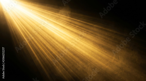 Golden spotlight beam shining through dark space with bright glowing dust particles creating a cinematic and dramatic atmospheric lighting effect