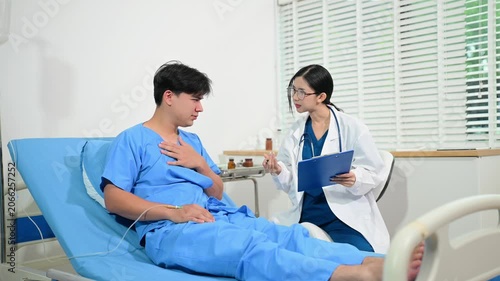 atient reviewing and signing medical consent documents with healthcare staff during hospital registration, consultation, treatment preparation