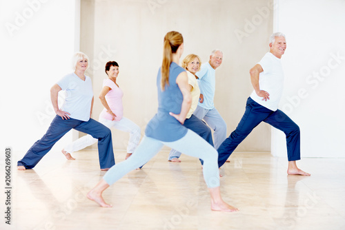 Fotografie Pilates, instructor and stretching with elderly people for wellness, support and fitness in retirement