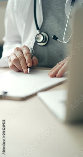 Medical doctor completing administrative healthcare records