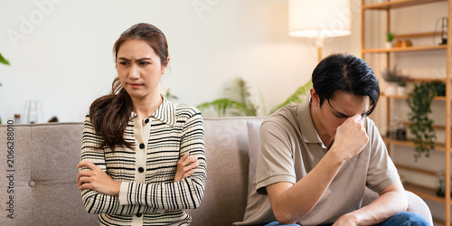 Bilde på lerret Relationship problems family crisis asian couple divorce marriage sad worried man husband thinking solution contemplating offended woman wife sitting in living room