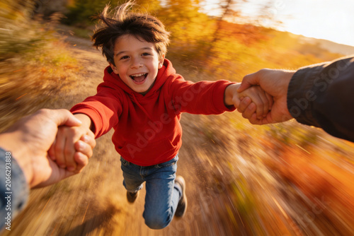 First Person Point of View of Parent Spinning Happy Laughing Little Son Outdoors in Autumn Park