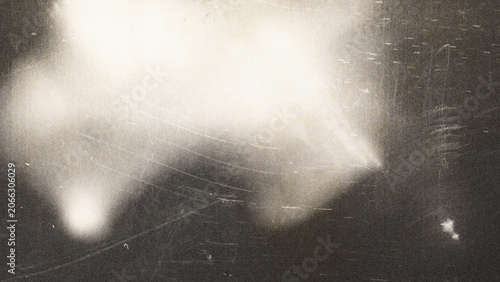 Quadro su tela Cinematic film grain texture with soft light leaks, vintage analog photography aesthetic on dark background, grainy noise overlay for retro video editing and nostalgic creative design work