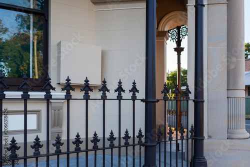 Wrought iron railing fence around old restored historic building