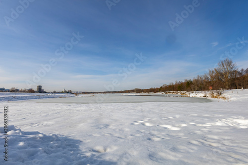 Frozen urban lake in spring