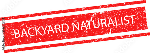 Φωτογραφία A red grunge rubber stamp with the text backyard naturalist for nature explorati