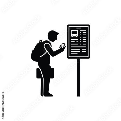 Person waiting at a public bus stop station while checking a mobile phone for transportation updates