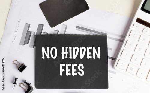 No hidden fees concept with calculator, financial charts and office supplies representing transparent pricing, cost disclosure, fair billing,