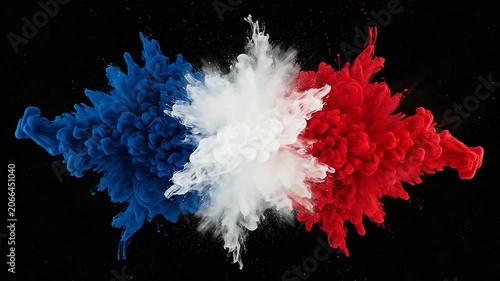 Explosion of blue white and red powder on a black background