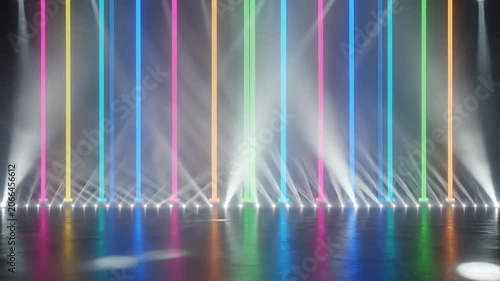 Vibrant stage with colorful neon vertical light bars and bright white spotlights