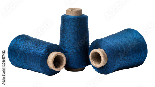 Tableau sur toile Isolated three dark blue thread spools for sewing, crafts, and textile work