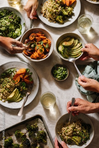 Family sharing healthy meal around dining table