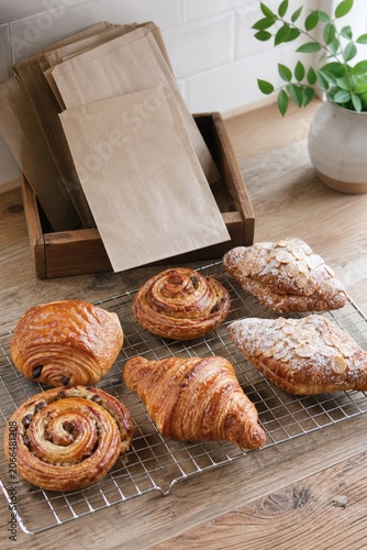 Fresh artisan bread and pastries on bakery table