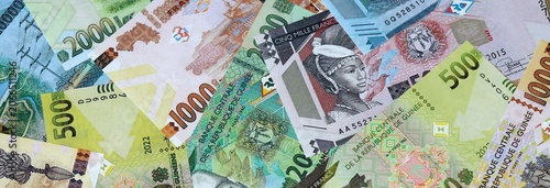 Photos Guinean franc money banknotes bunch on table