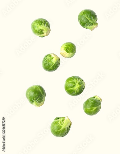 Fresh Raw Green Brussels Sprouts Scattered Naturally, Expertly Isolated Over a Pure White Background