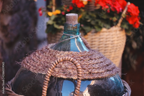 Cuadro en lienzo A glass bottle with a rope wrapped around it