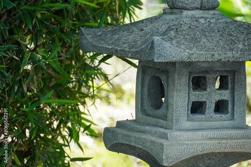 Photography Stone lantern with bamboo leaves in a tranquil garden setting