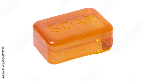 Obraz na płótnie Orange translucent soap bar with embossed word SOAP