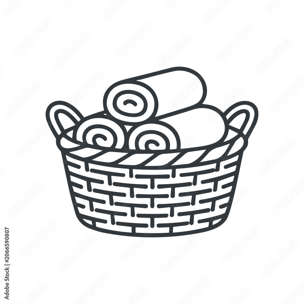 Obraz premium Rolled towels in a basket.