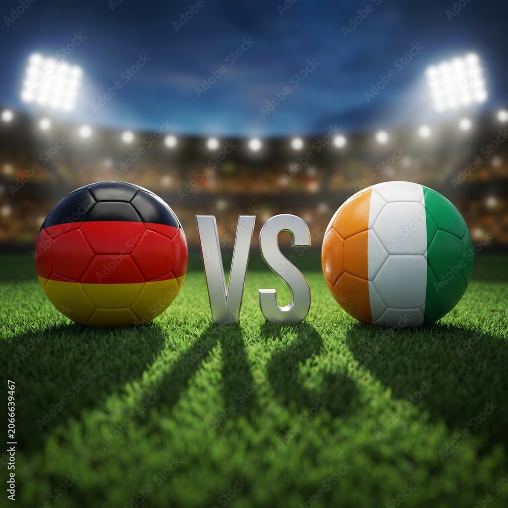 Fototapeta premium Germany vs Ivory Coast Soccer Match: Footballs on Grass with Stadium Lights
