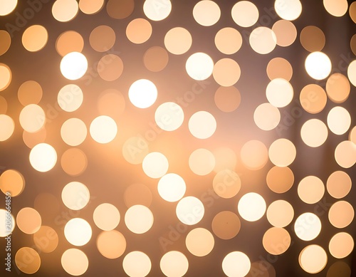 Golden bokeh light abstract background texture.