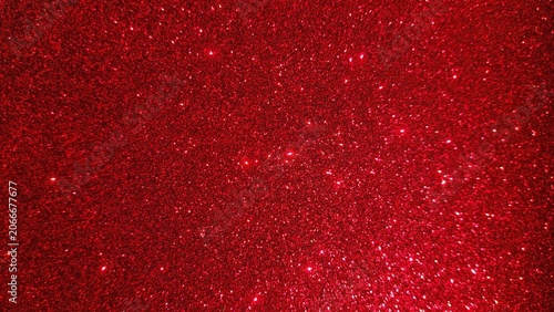 Obraz na plátně Beautiful abstract red glitter background featuring bright glowing particles