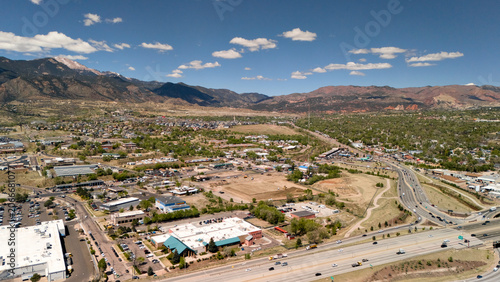 Tableau sur toile Aerial view of Colorado Springs suburban area with highway and Rocky Mountains i