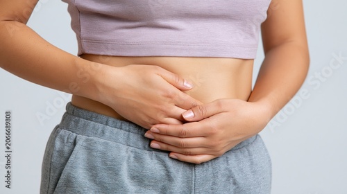 Acute ache after situps. Feel discomfort after sit-ups? Toned woman massages her abdomen after abdominal crunches
