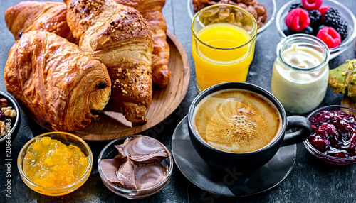 Italian breakfast served with croissants orange juice and coffee