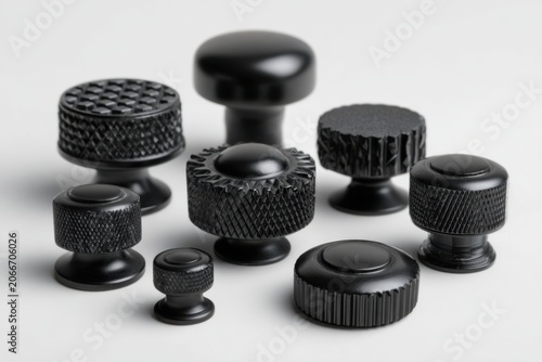 Collection of Black Knobs and Handles for Industrial Applications.