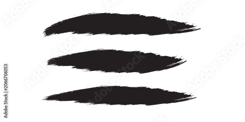 Set of three black grunge brush strokes on white background.