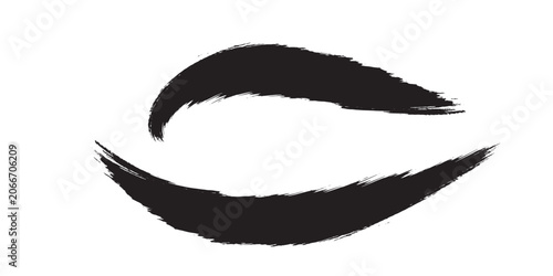 Abstract black brush strokes forming an eye shape on a white background.